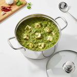 Load image into Gallery viewer, Paneer curry with green spinach sauce in stainless steel pot with chili, garlic, and coriander