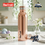 Copper stainless steel water bottle on kitchen counter with flowers and pastel eggs