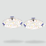 Load image into Gallery viewer, Two stainless steel idli steamers with seven idlis each garnished with vegetables and herbs