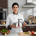 Load image into Gallery viewer, Female chef in white uniform holding MaxFresh pressure cooker in modern kitchen with fresh vegetables
