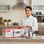Load image into Gallery viewer, Smiling female chef presenting Max Fresh Triply 3-liter pressure cooker in modern kitchen