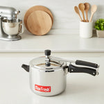 Load image into Gallery viewer, Stainless steel Max Fresh pressure cooker with black handles on white kitchen countertop