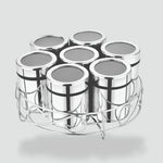 Load image into Gallery viewer, Set of seven stainless steel spice jars with transparent lids in a round metal holder