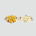 Load image into Gallery viewer, Two stainless steel serving plates with Indian sweets dhokla and milk peda garnished with herbs