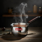 Load image into Gallery viewer, Max Fresh stainless steel saucepan with wooden handle steaming on wooden table in kitchen