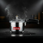 Load image into Gallery viewer, Max Fresh stainless steel pressure cooker with black handle releasing steam on black countertop