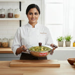 Load image into Gallery viewer, Chef holding MaxFresh stainless steel kadai with green curry in modern kitchen