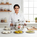 Load image into Gallery viewer, Smiling chef lifting glass lid of Max Fresh stainless steel pot with Indian dishes on table