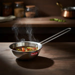 Load image into Gallery viewer, Steaming stainless steel Max Fresh pan with spiced oil, dried red chilies, and curry leaves on wooden surface