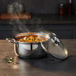 Load image into Gallery viewer, Steaming stainless steel pot with tofu and green peas curry on kitchen counter