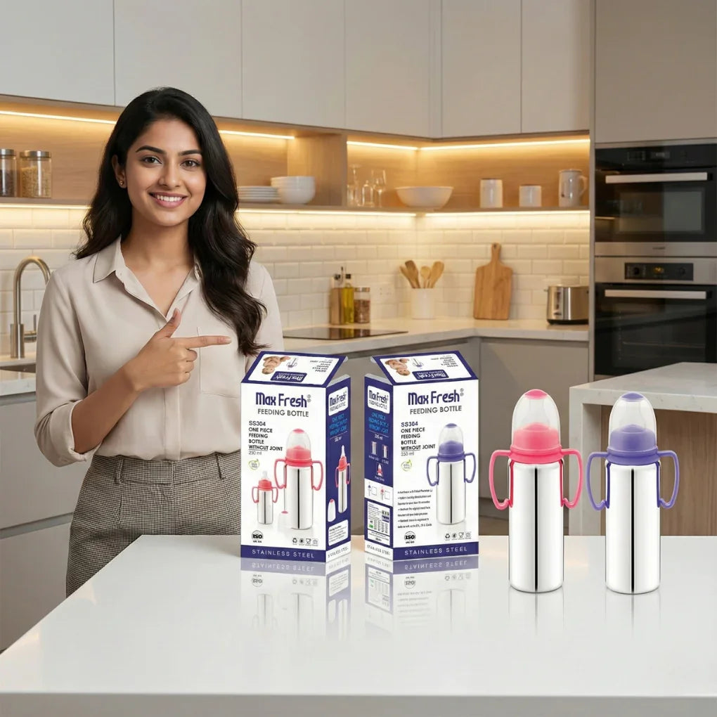 Woman in kitchen with Max Fresh stainless steel feeding bottles and packaging on counter