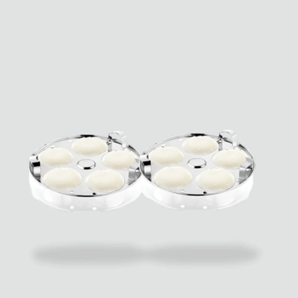 Stainless steel idli plates with fresh idlis, kitchenware for healthy cooking