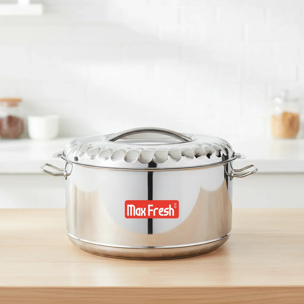 Stainless steel casserole with lid on kitchen counter, Max Fresh logo on pot