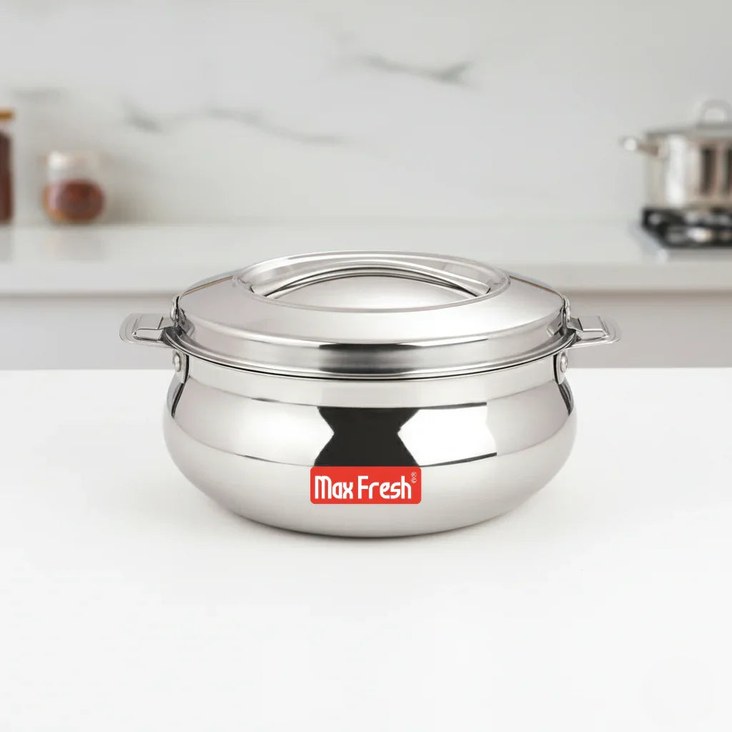 Stainless steel casserole with lid and handles on kitchen counter, premium cookware