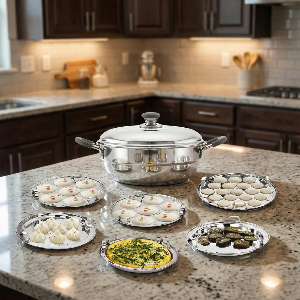 Multipurpose stainless steel multi kadai with various cooking plates on a kitchen counter