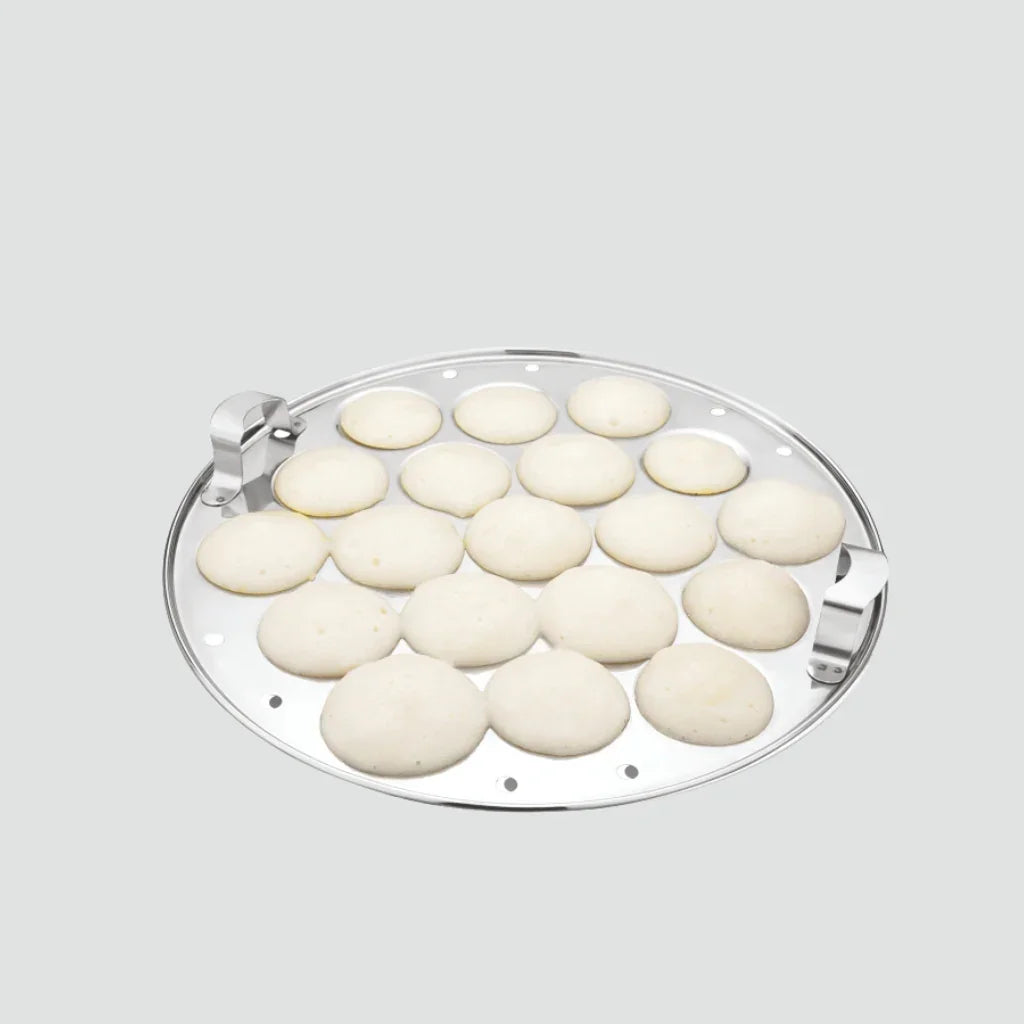 Stainless steel idli plate with cooked idlis, kitchenware cooking accessory