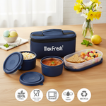 Three-piece lunch box set with blue containers, insulated bag, fruit, and roti, microwave safe.