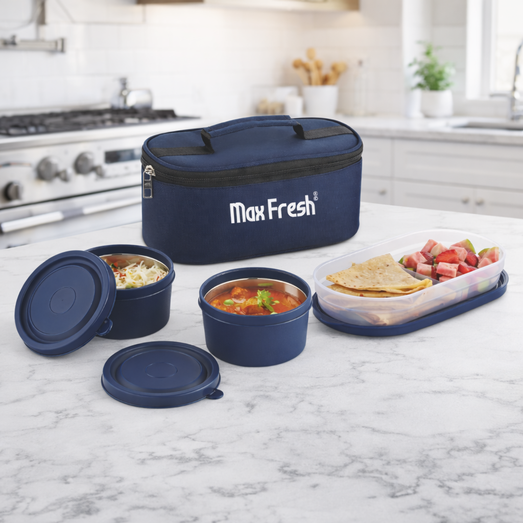 Three-piece blue lunch box set with food containers and insulated bag on kitchen counter