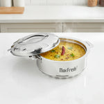 Load image into Gallery viewer, Steaming yellow dal garnished with coriander and dry chili in Max Fresh stainless steel hotpot on white countertop
