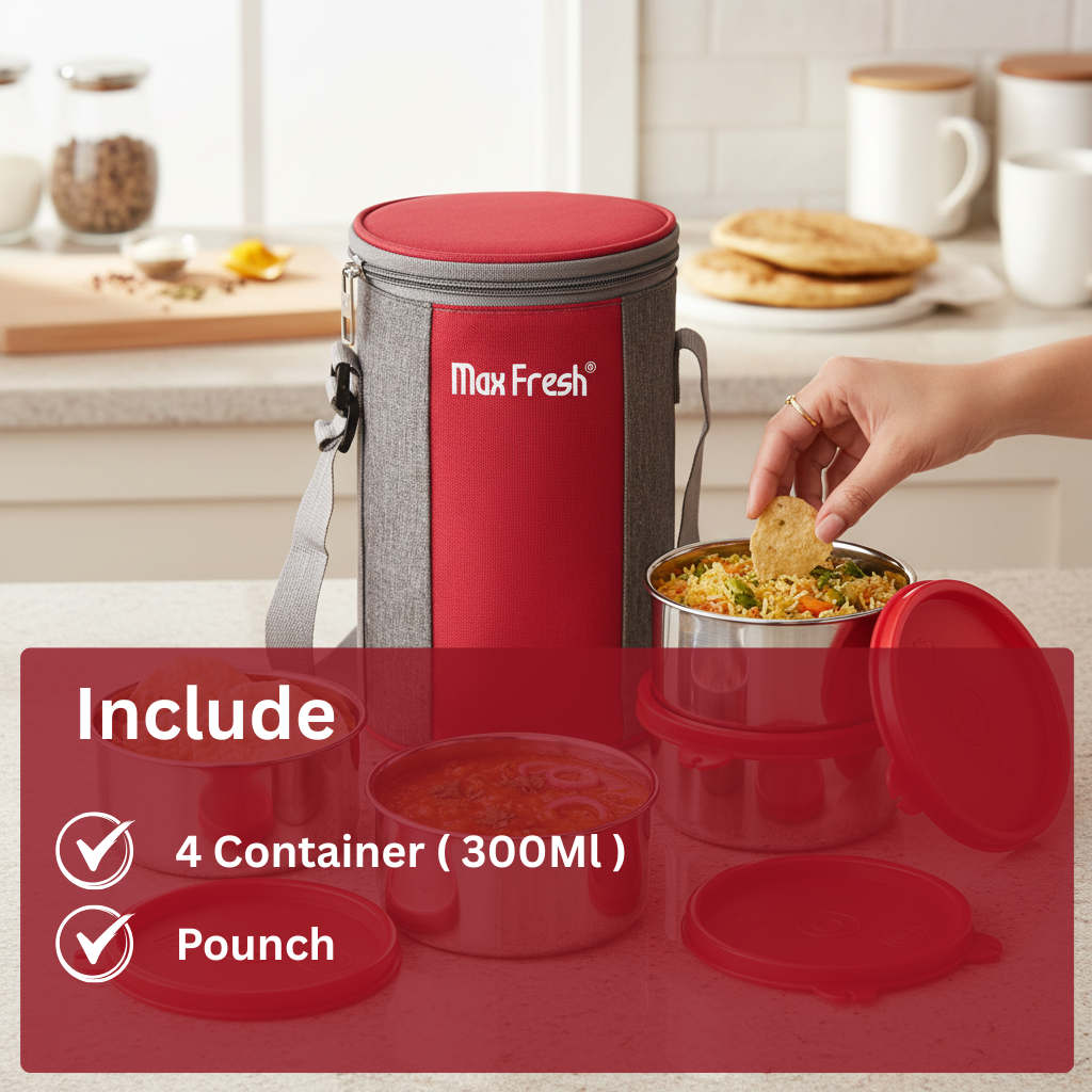 Stainless steel lunch containers with red lids and insulated pouch, food being served in kitchen.