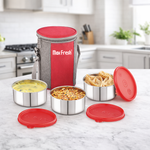 Stainless steel lunch box set with red lids and insulated carry bag on kitchen counter