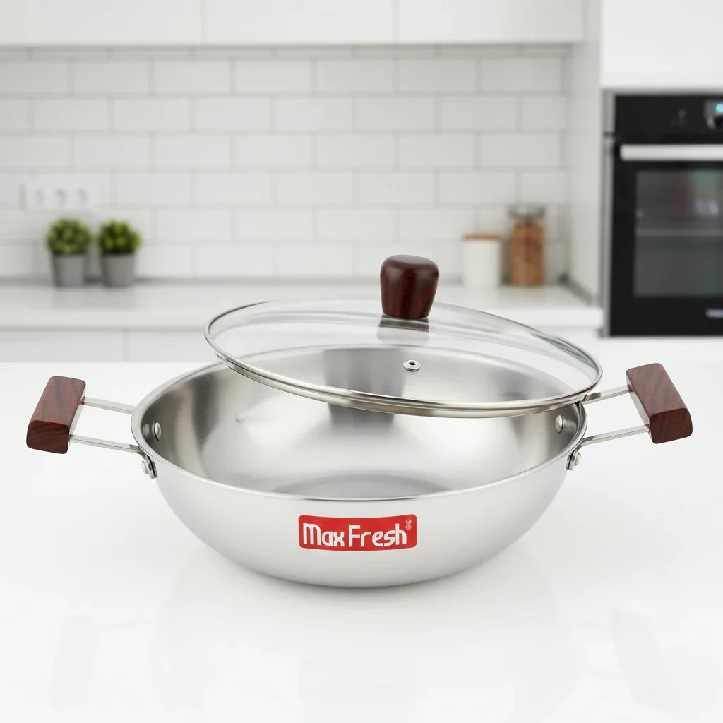 Stainless steel triply kadai with glass lid and wooden handles in modern kitchen