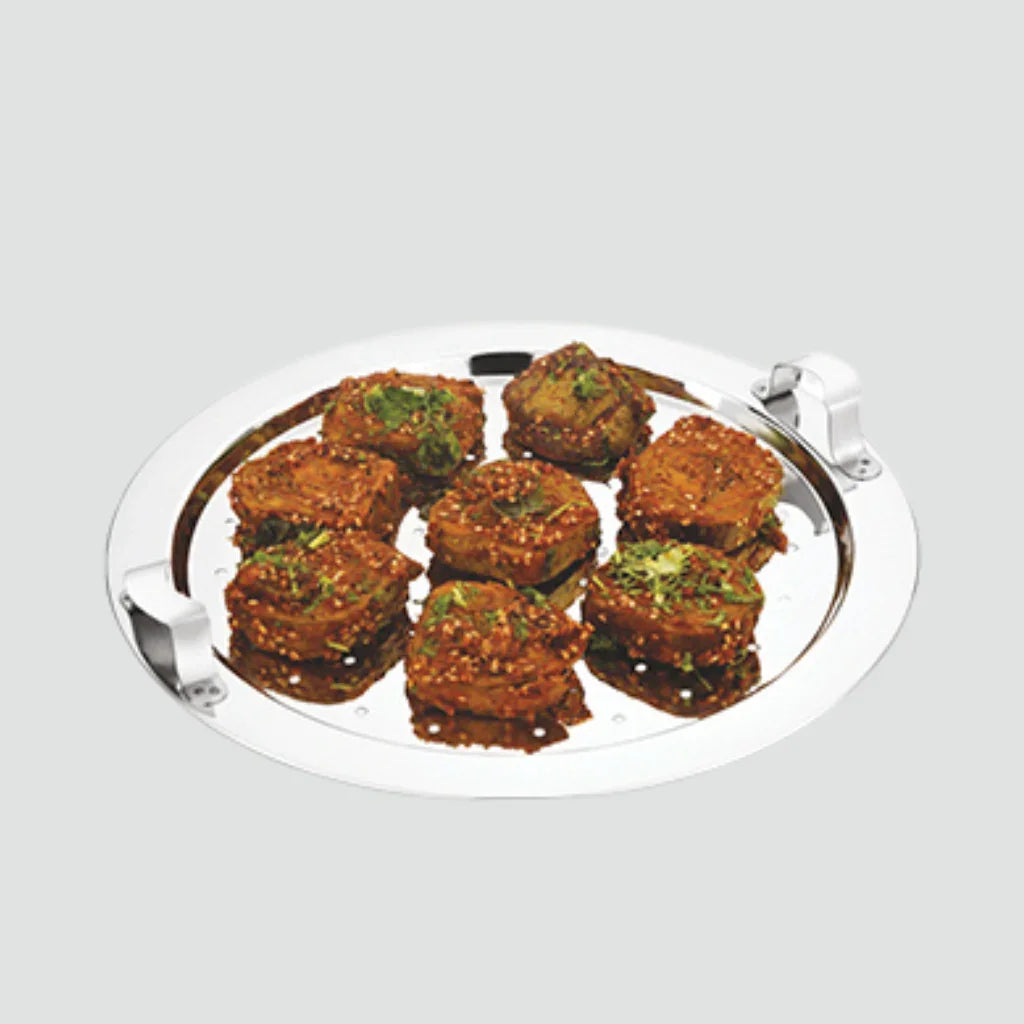 Stainless steel multi kadai plate with savory snacks, ideal for healthy cooking