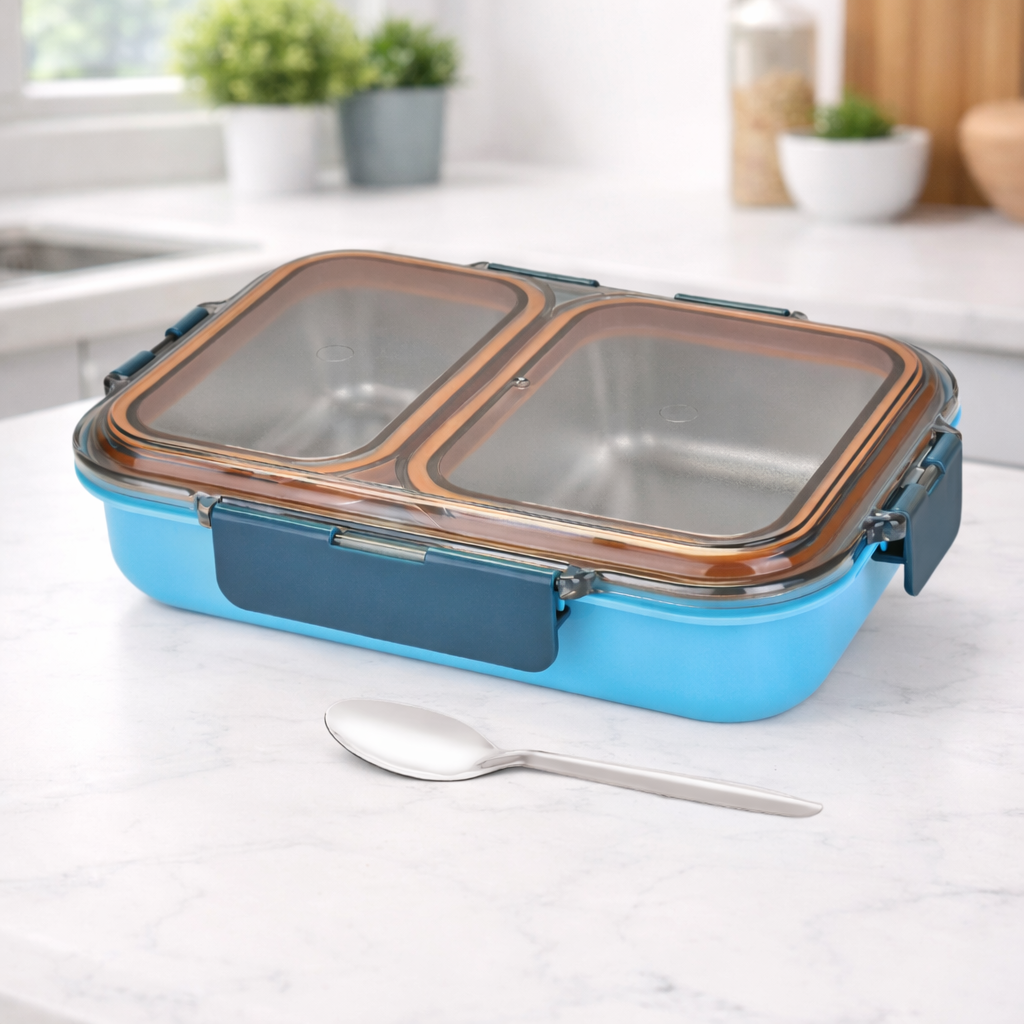 Stainless steel divided casserole with blue base and airtight lid on kitchen counter