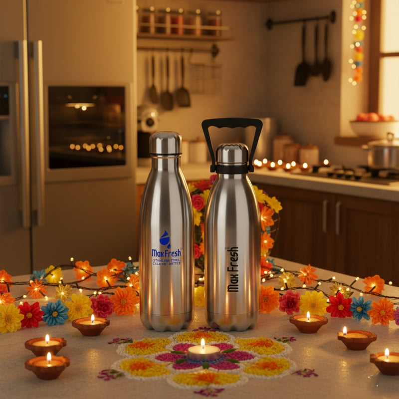 Two Max Fresh water bottles on a decorative table with candles and flowers in a kitchen setting.