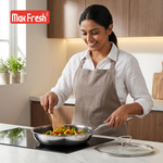 Woman cooking in a kitchen with Max Fresh logo