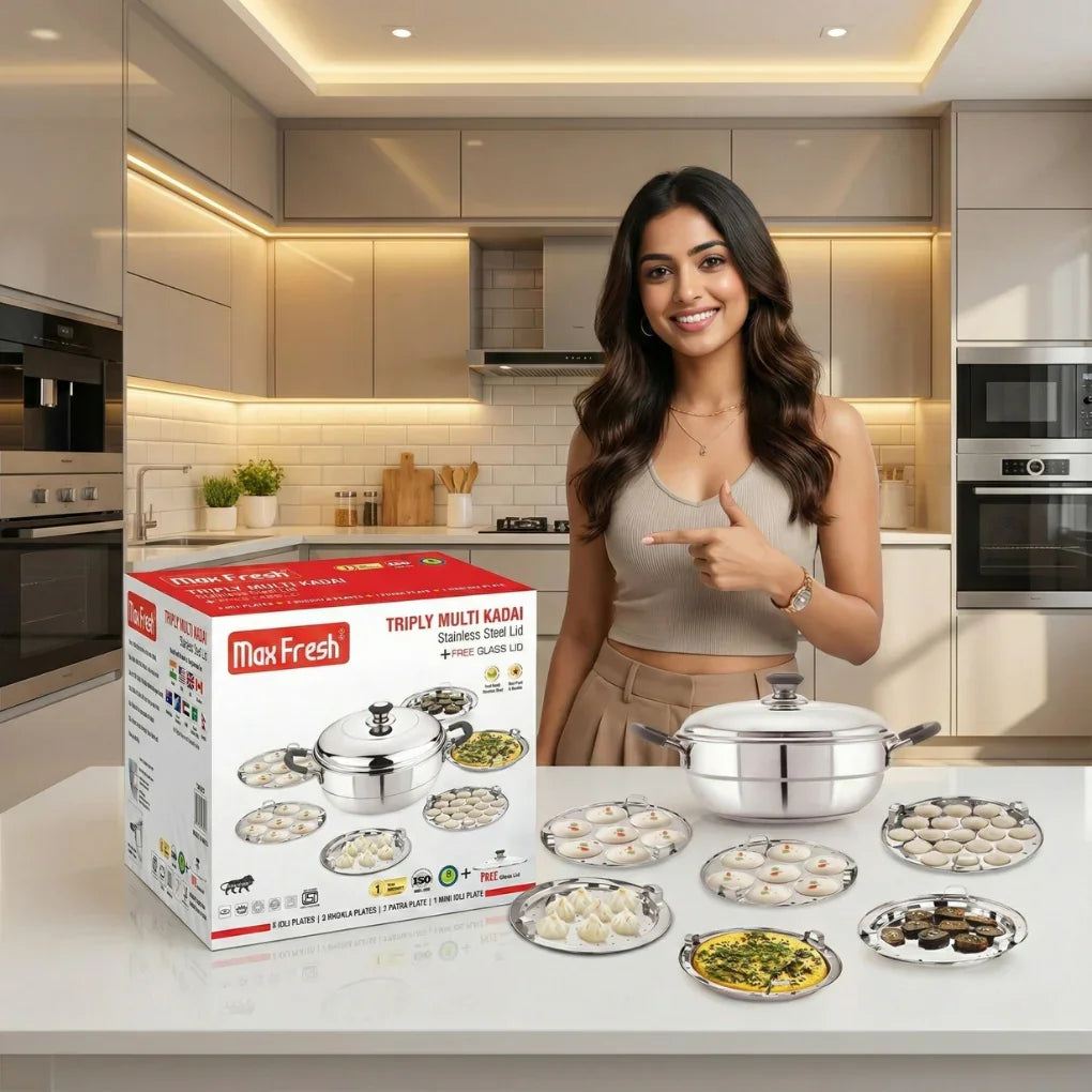 Smiling woman in modern kitchen presenting Max Fresh Triply Multi Kadai stainless steel cookware with multiple plates displayed