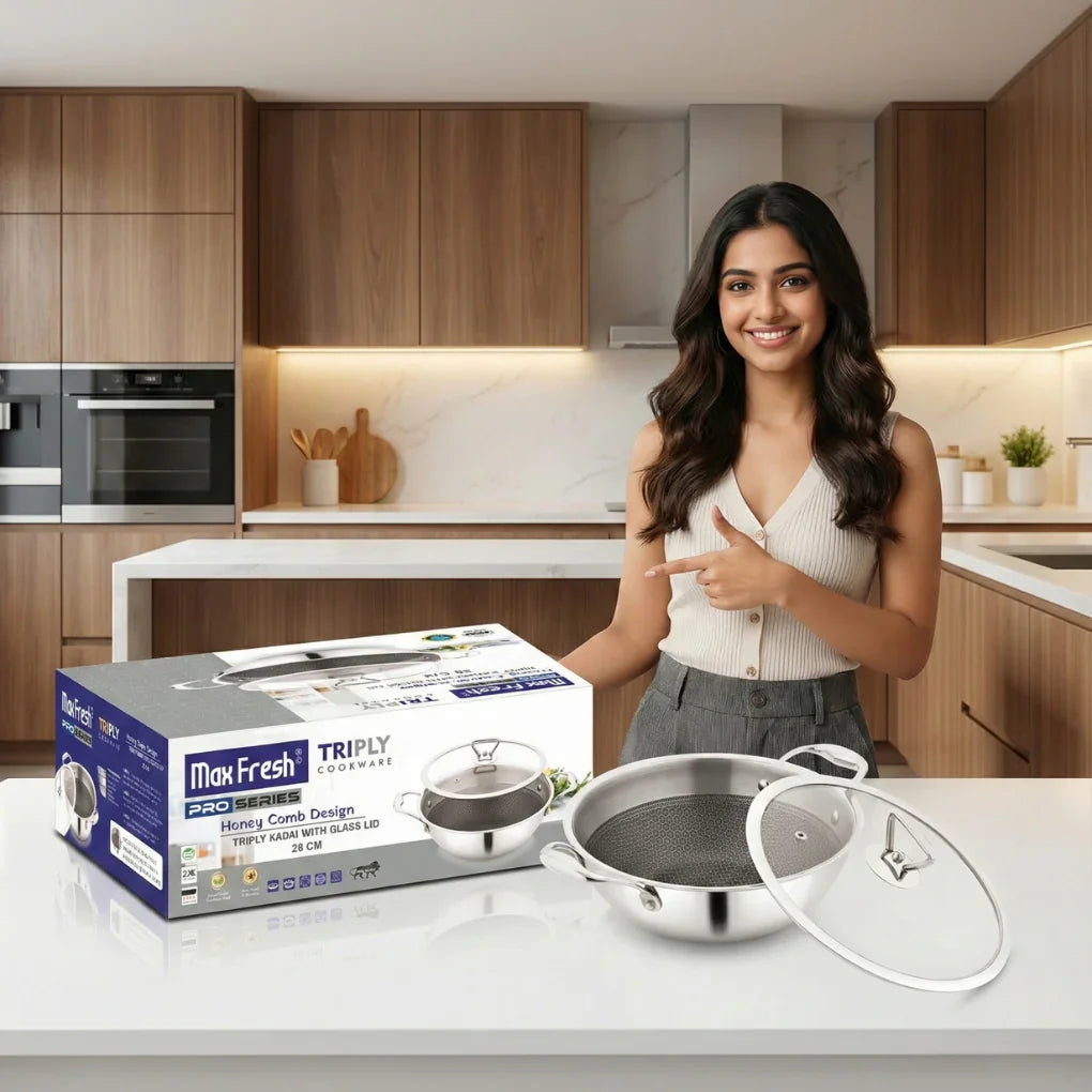 Woman presenting stainless steel triply kadai with glass lid in modern kitchen