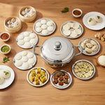 Load image into Gallery viewer, Stainless steel multi-kadai deep sandwich cooker surrounded by plates of South Indian snacks and chutneys on wooden table
